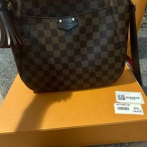 - Louis Vuitton cross body bag- 
Damier Ebene South Bank Besace